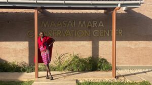 A Maasai in front of the Maasai Mara Conservation Center. Credit - Oli Dreike