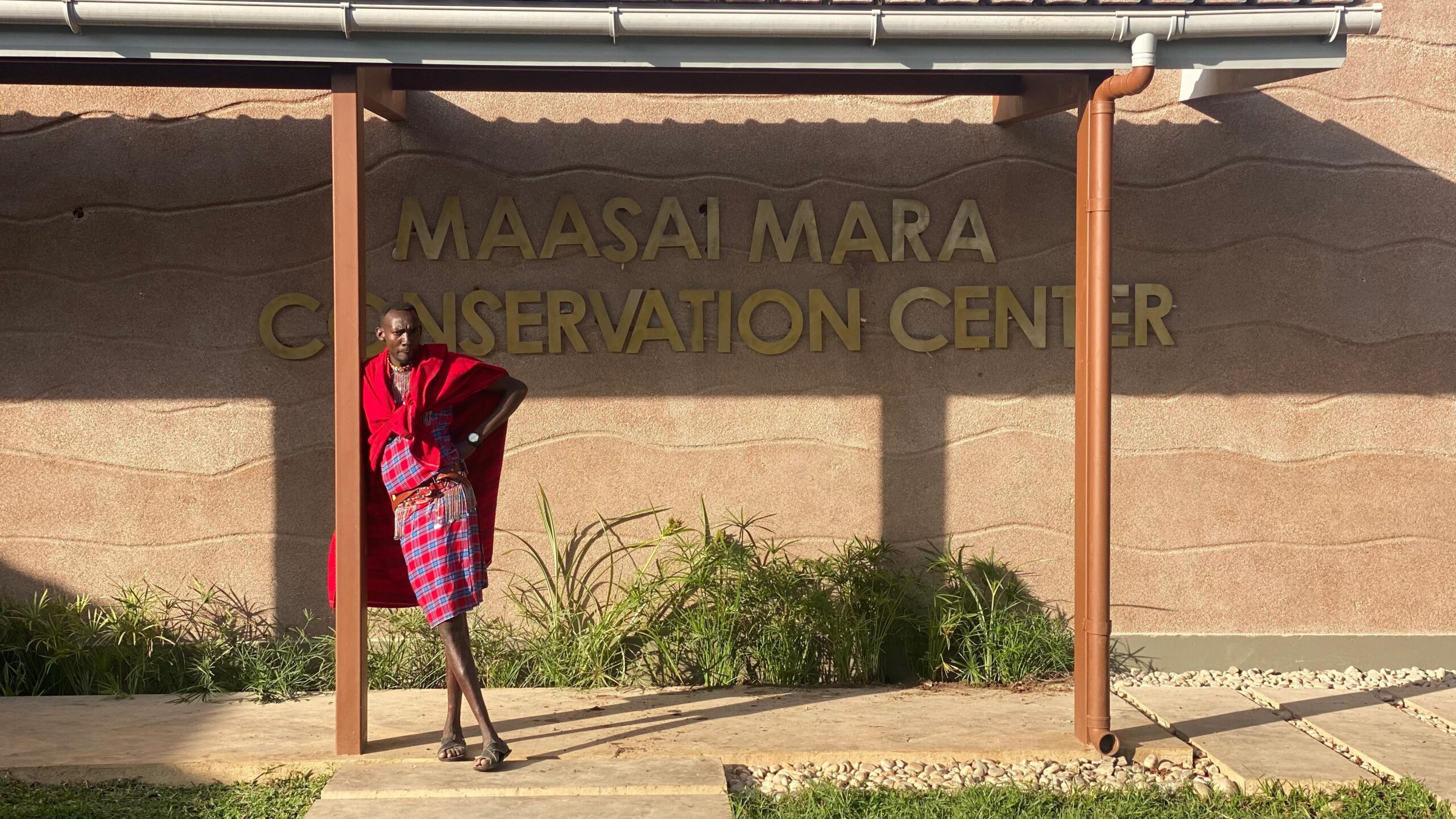 A Maasai in front of the Maasai Mara Conservation Center. Credit - Oli Dreike