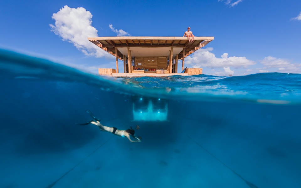 Diving in the water outside the underwater room at Manta Resort in Pemba Island, Tanzania.