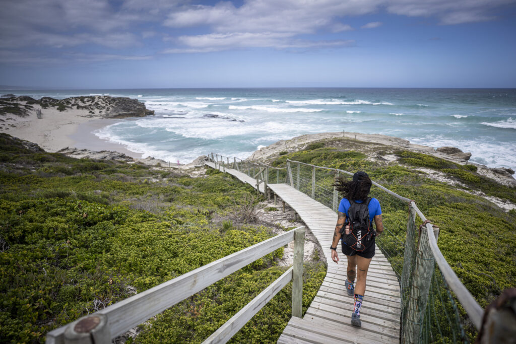 Woman hiking in De Hoop Nature Reserve beside the coast