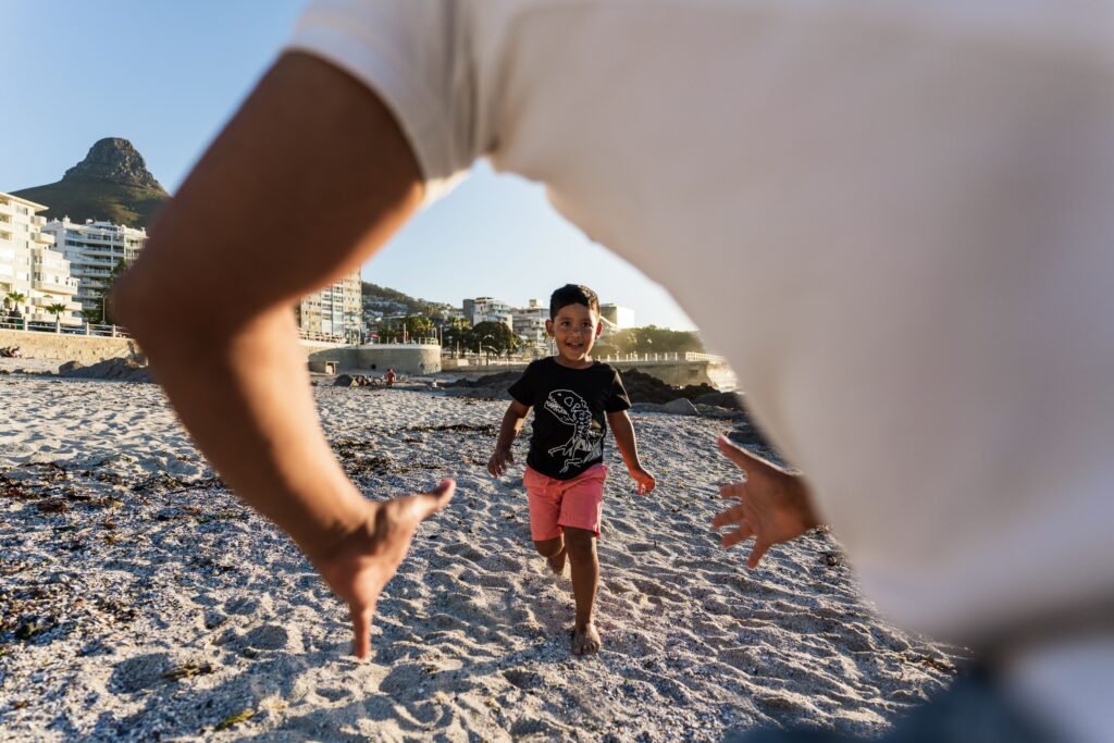 Family enjoying time at the beach in Cape Town, South Africa